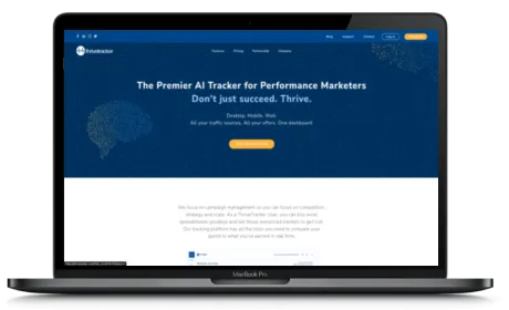 ThriveTracker website displayed on a Macbook